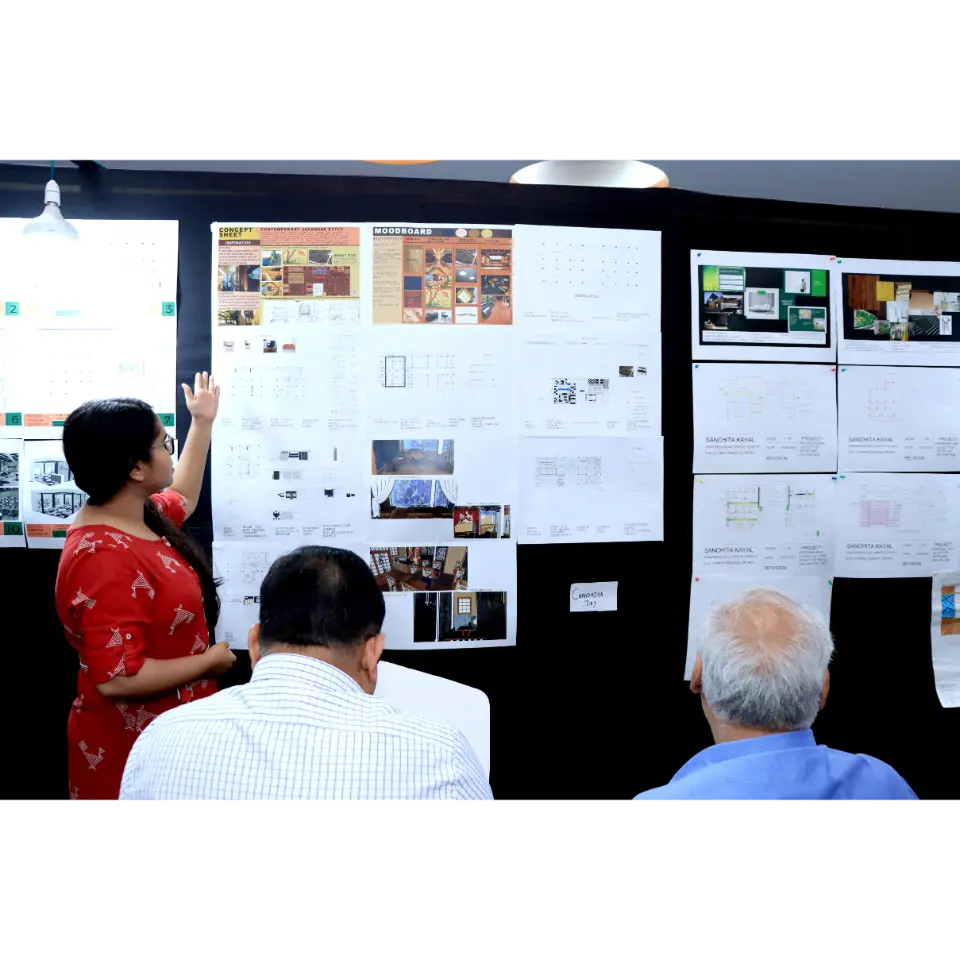 The students showcasing teh interior projects for the conference